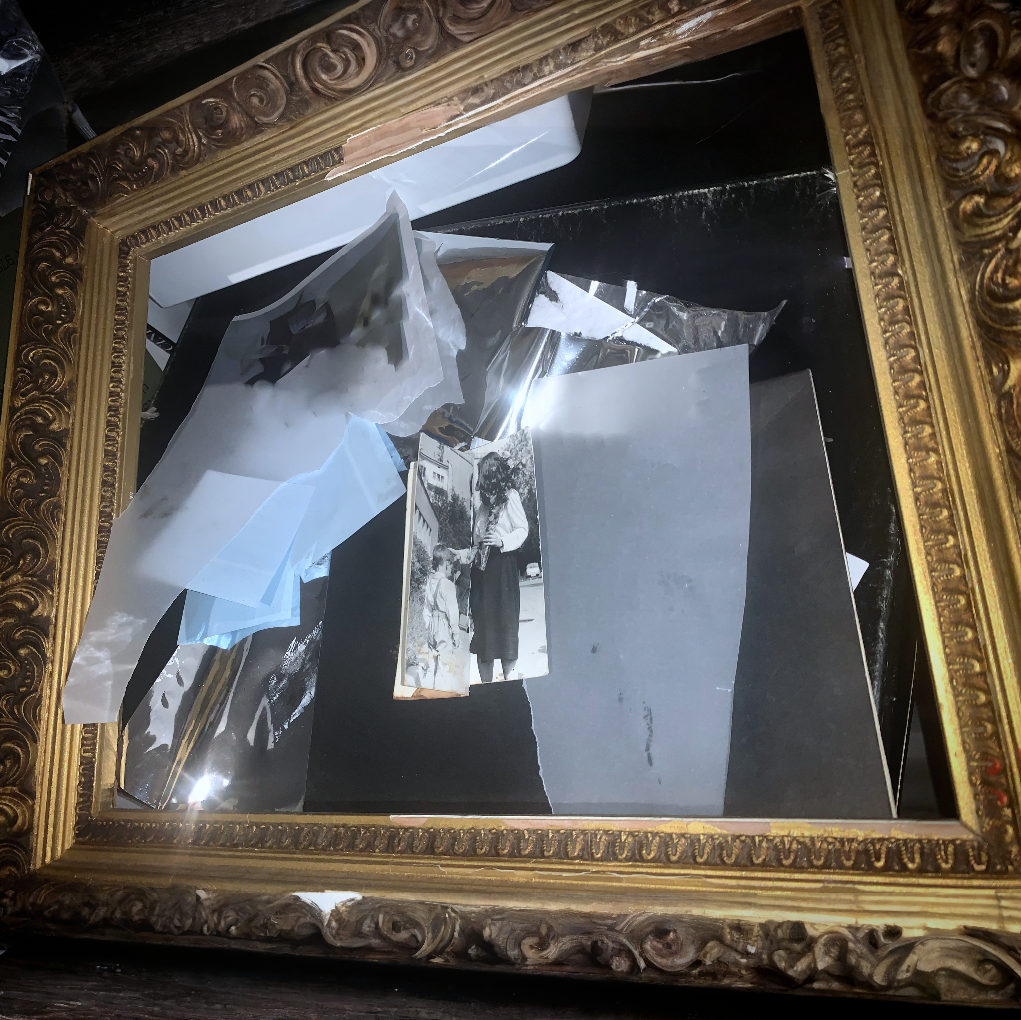 No Strings Attached — cover artwork: a gilt frame holding torn photographs, film negatives and blue transparencies
